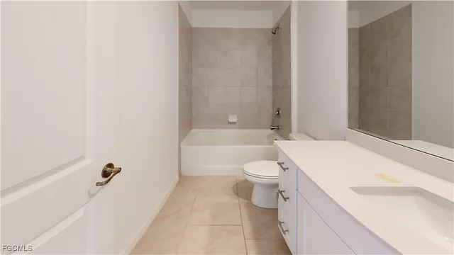 a bathroom with a toilet a sink and bathtub