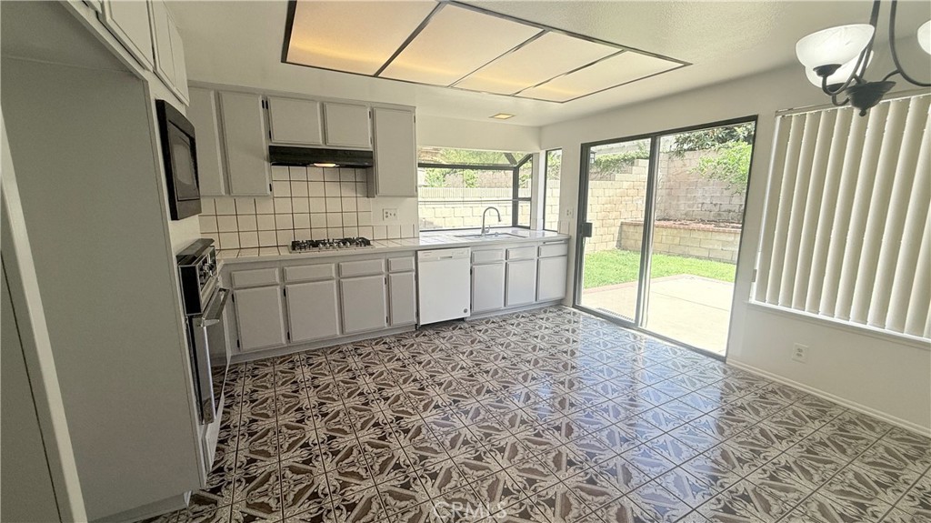 46 Christamon West Irvine, CA 92620 - Photo 12 of 65 a room with window and chandelier