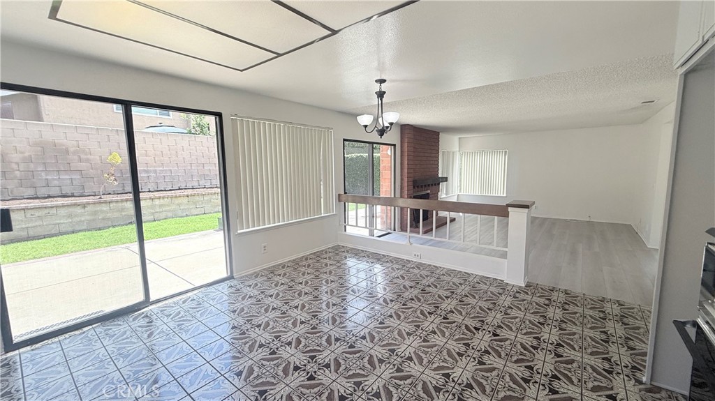 46 Christamon West Irvine, CA 92620 - Photo 14 of 65 a view of a living room and a floor to ceiling window