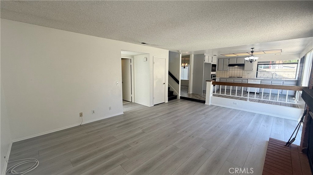 46 Christamon West Irvine, CA 92620 - Photo 20 of 65 wooden floor in an empty room with a window
