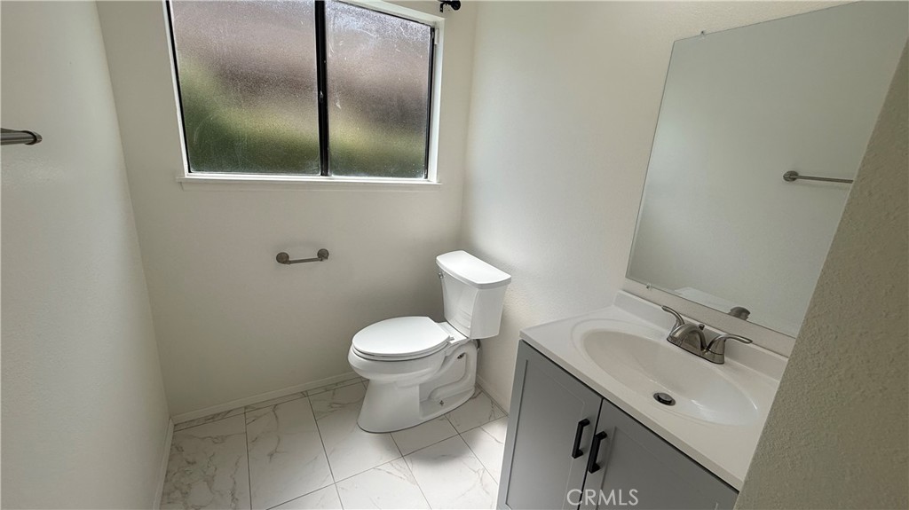 46 Christamon West Irvine, CA 92620 - Photo 22 of 65 a bathroom with a toilet sink and mirror