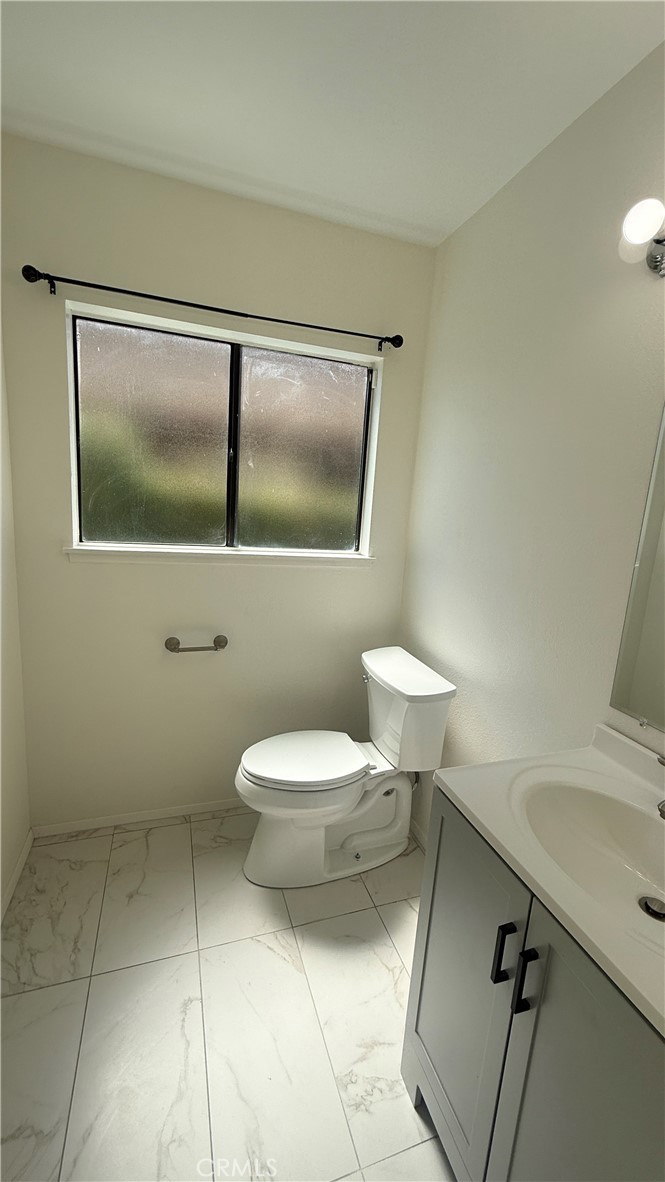 46 Christamon West Irvine, CA 92620 - Photo 23 of 65 a bathroom with a toilet sink and vanity