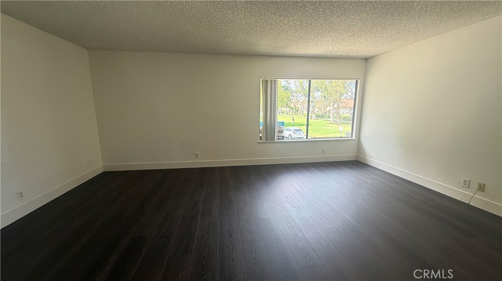 46 Christamon West Irvine, CA 92620 - Photo 31 of 65 an empty room with wooden floor and windows