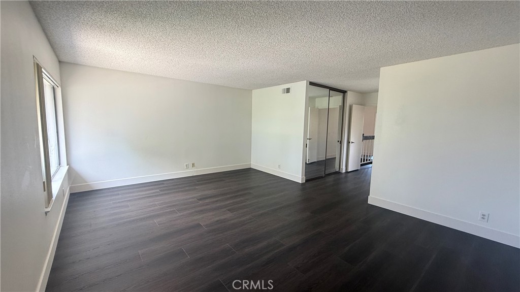 46 Christamon West Irvine, CA 92620 - Photo 33 of 65 an empty room with wooden floor and windows