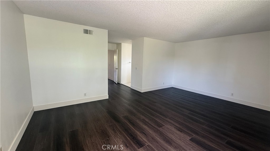 46 Christamon West Irvine, CA 92620 - Photo 34 of 65 a view of an empty room with wooden floor