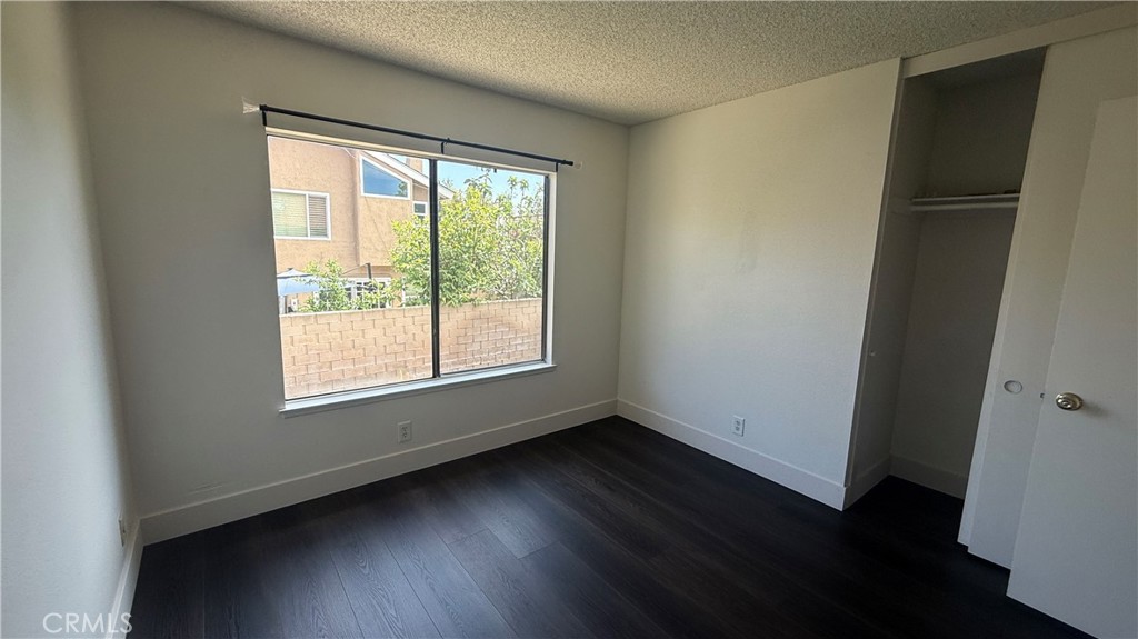 46 Christamon West Irvine, CA 92620 - Photo 40 of 65 an empty room with wooden floor and windows