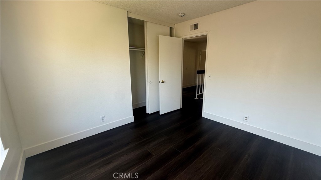 46 Christamon West Irvine, CA 92620 - Photo 41 of 65 a view of an empty room with wooden floor and a window