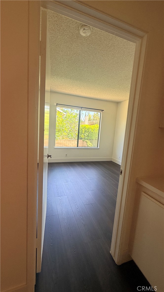 46 Christamon West Irvine, CA 92620 - Photo 44 of 65 an empty room with wooden floor and windows