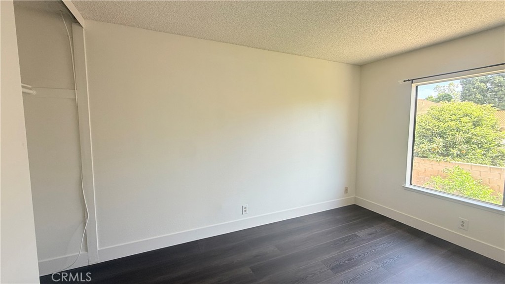 46 Christamon West Irvine, CA 92620 - Photo 48 of 65 an empty room with wooden floor and windows