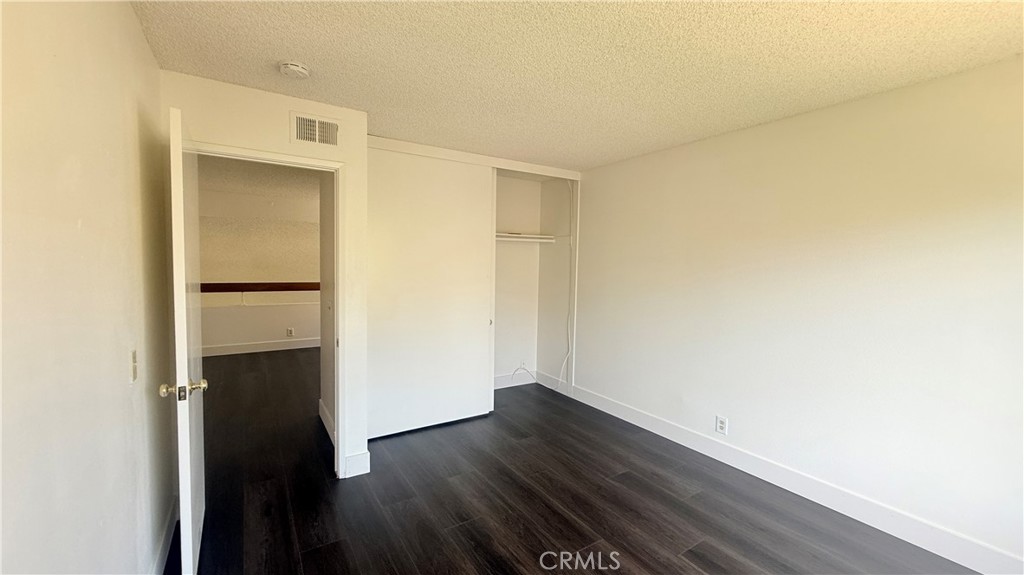 46 Christamon West Irvine, CA 92620 - Photo 49 of 65 a view of empty room with wooden floor