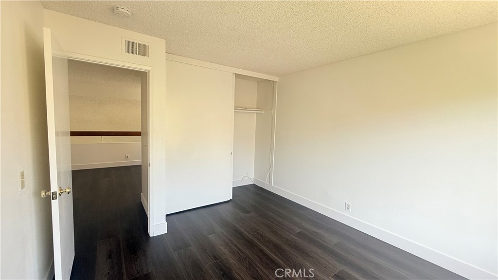 46 Christamon West Irvine, CA 92620 - Photo 51 of 65 a view of an empty room with wooden floor