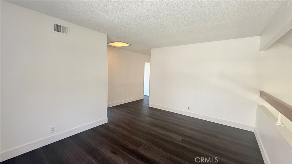 46 Christamon West Irvine, CA 92620 - Photo 55 of 65 a view of an empty room with wooden floor