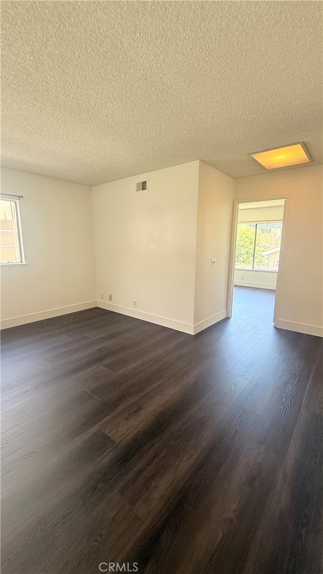 46 Christamon West Irvine, CA 92620 - Photo 59 of 65 a view of an empty room with wooden floor and a window