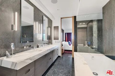 a bathroom with a shower and a sink