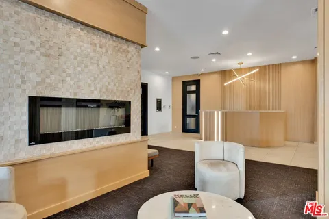 a lobby with furniture and rug