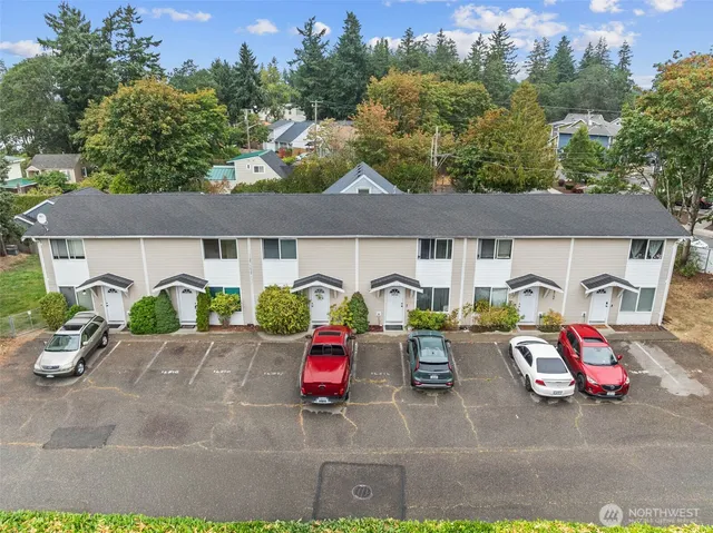a view of a patio with table and chairs potted plants