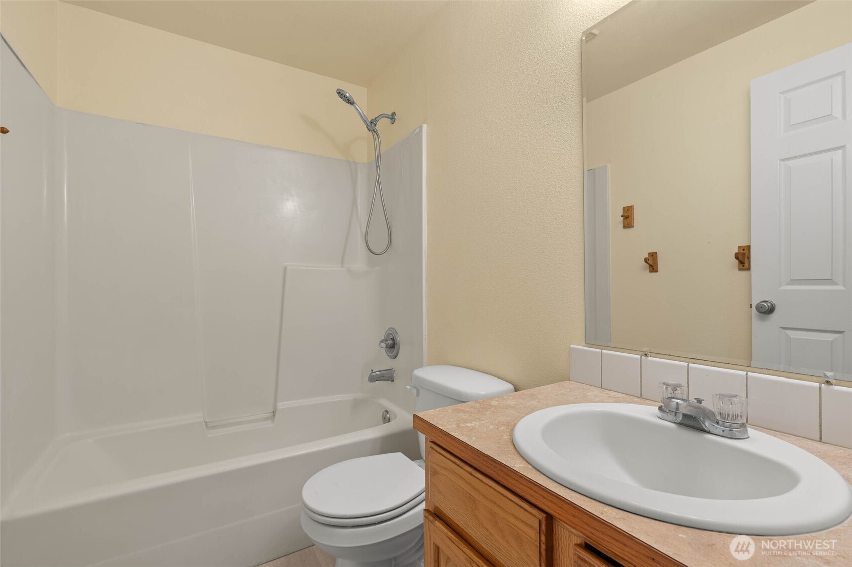 14510 West Throne Lane Southwest Lakewood, WA 98498 - Photo 19 of 28 a bathroom with a sink toilet and shower