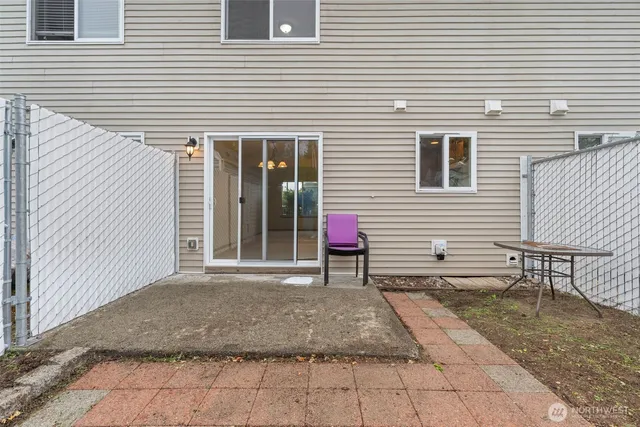 a view of a house with a bench
