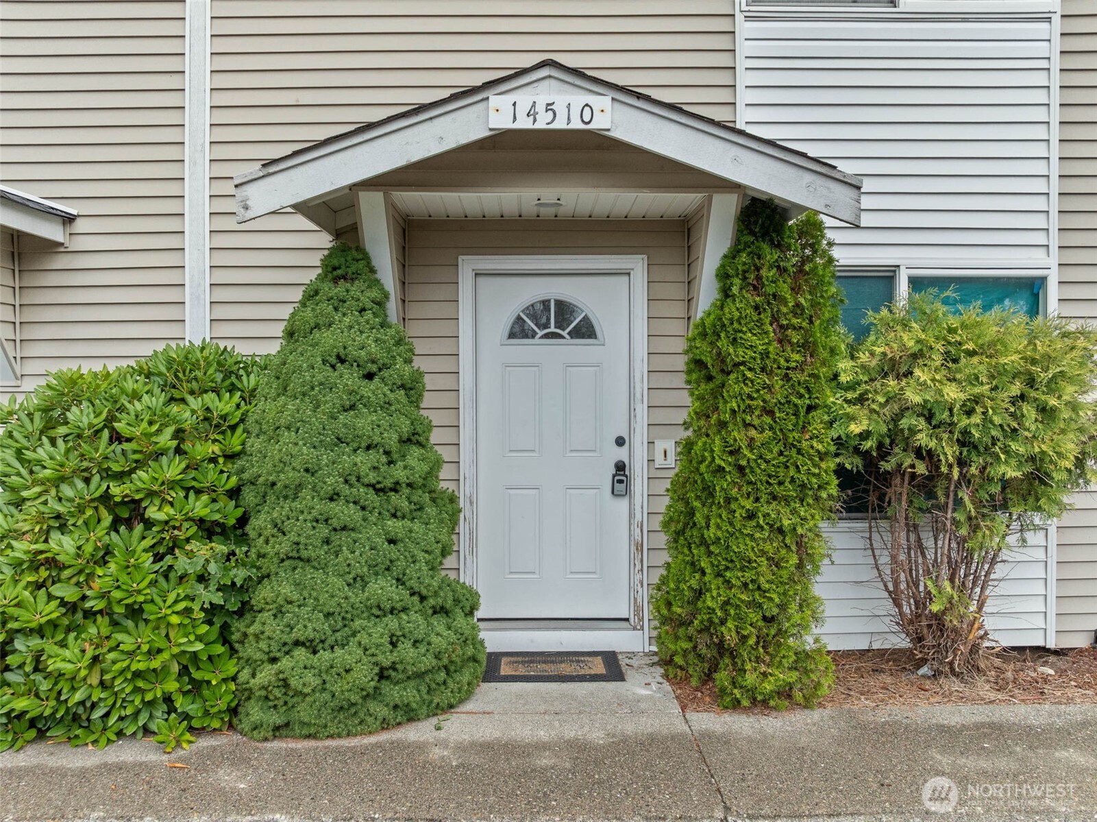 14510 West Throne Lane Southwest Lakewood, WA 98498 - Photo 2 of 28 a front view of a house with garden