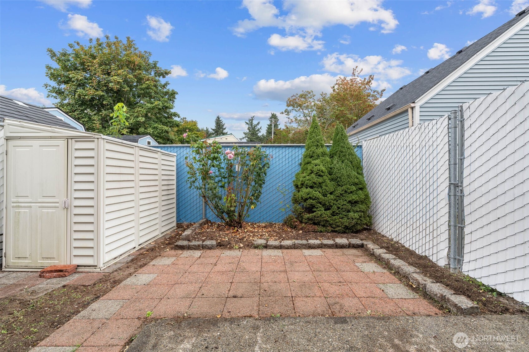 14510 West Throne Lane Southwest Lakewood, WA 98498 - Photo 23 of 28 a view of a yard with plants and a bench