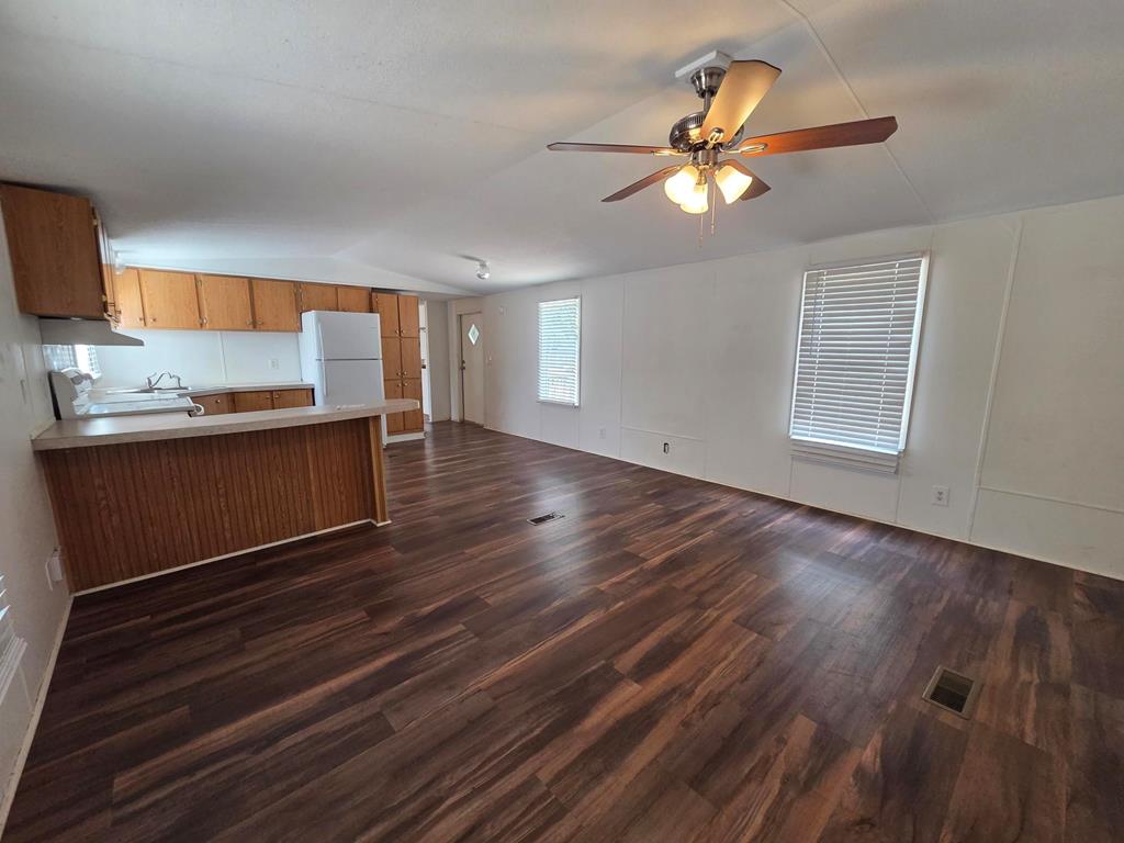 167-6 Beaumont Street Bandera, TX 78003 - Photo 3 of 10 a view of a room with a dishwasher and wooden floor