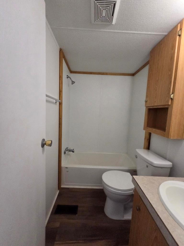 167-6 Beaumont Street Bandera, TX 78003 - Photo 7 of 10 a bathroom with a toilet and a shower