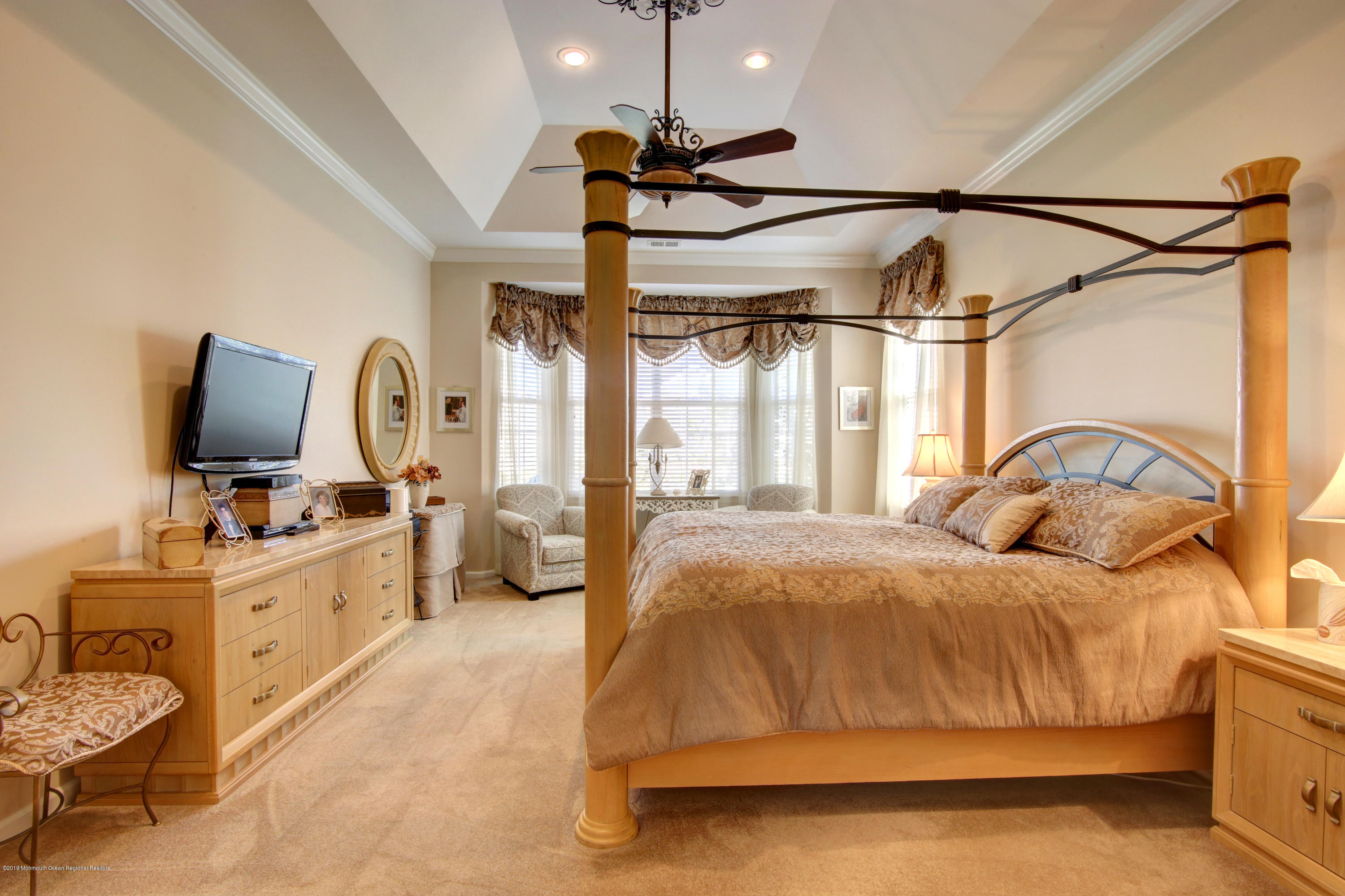 25 Hartack Road Manalapan, NJ 07726 - Photo 11 of 20 a bedroom with a bed and a flat screen tv