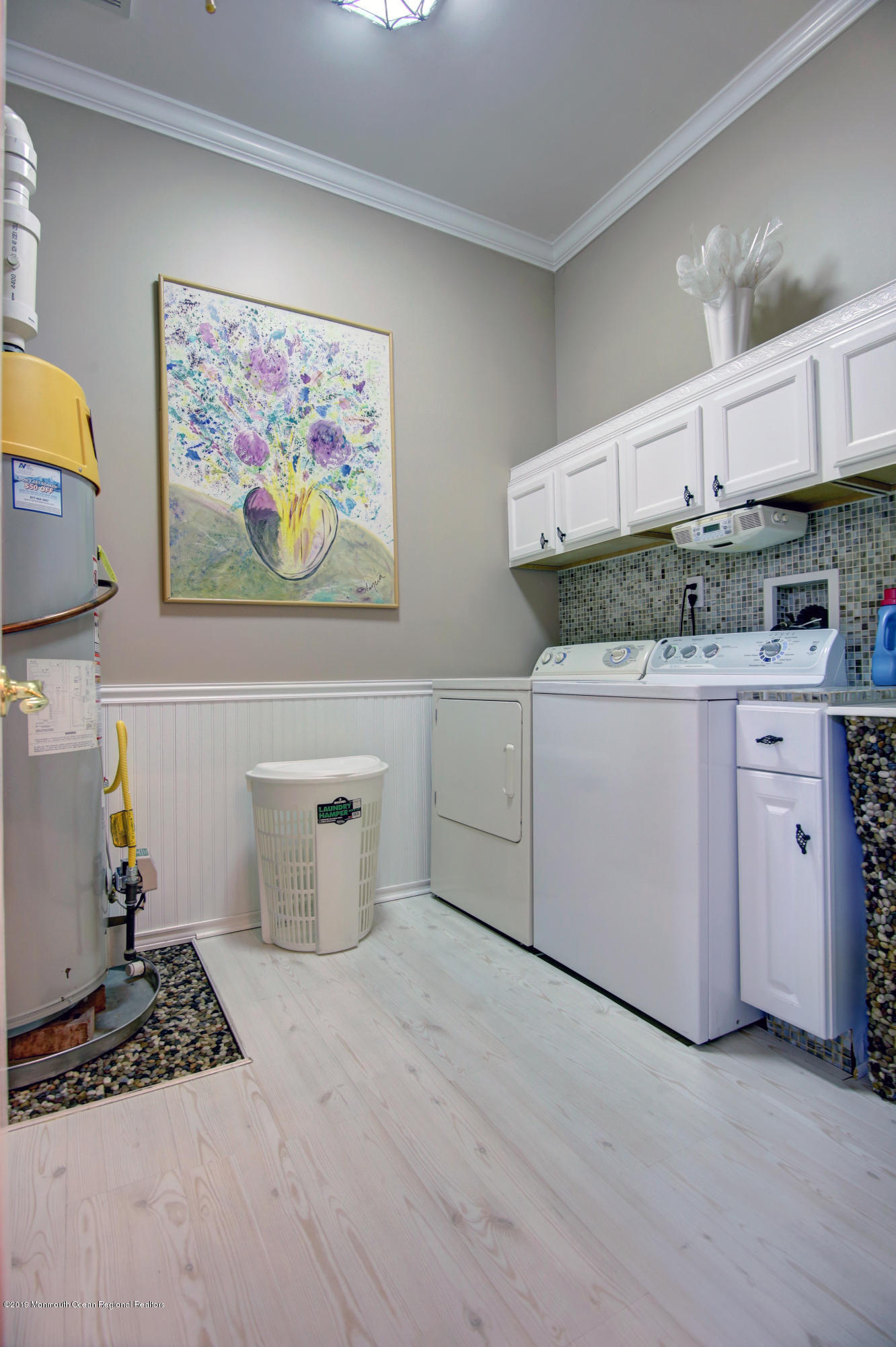 25 Hartack Road Manalapan, NJ 07726 - Photo 16 of 20 a kitchen with granite countertop a stove a sink and a microwave