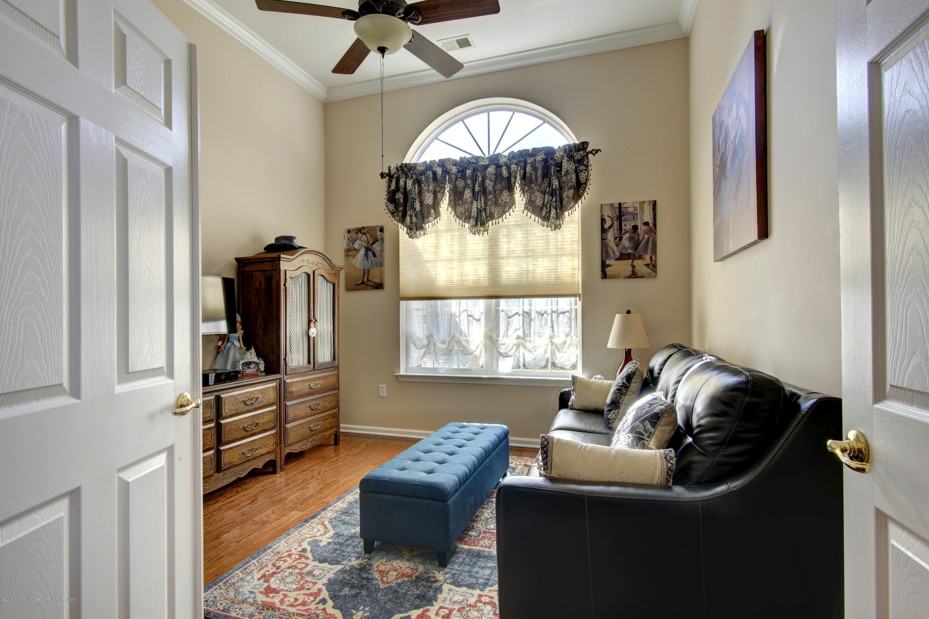 25 Hartack Road Manalapan, NJ 07726 - Photo 17 of 20 a living room with furniture and a flat screen tv