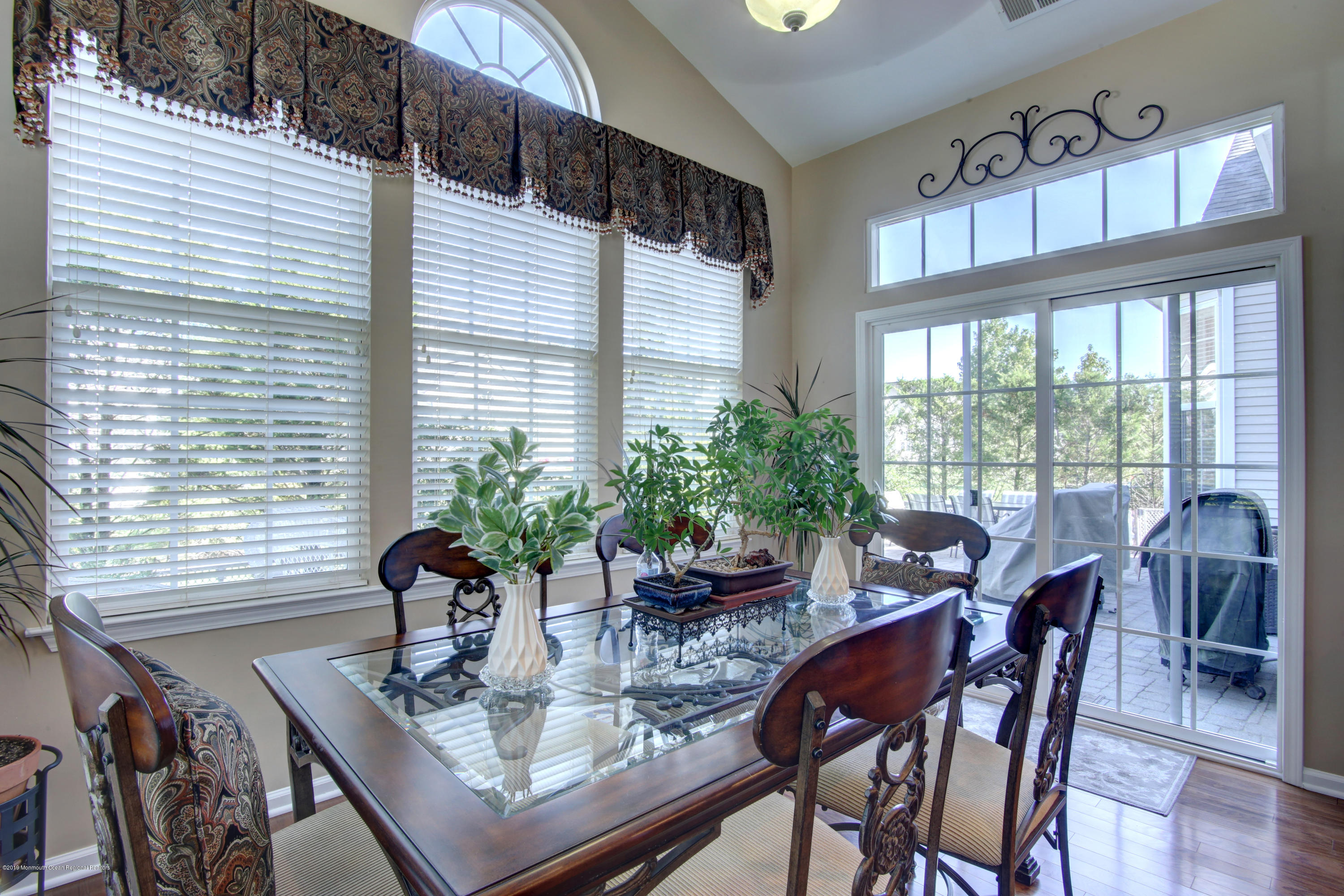 25 Hartack Road Manalapan, NJ 07726 - Photo 9 of 20 a view of a dining room with furniture window and outside view
