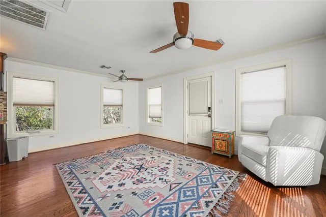 a living room with furniture and a rug