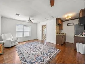 a bedroom with furniture and a window