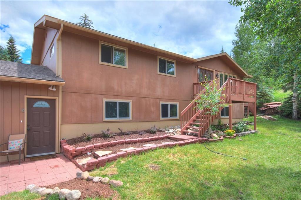 627 Deer Path Road Dillon, CO 80435 - Photo 2 of 25 a backyard of a house with table and chairs