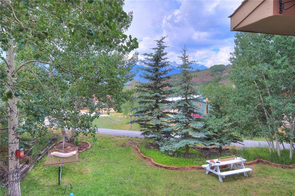 627 Deer Path Road Dillon, CO 80435 - Photo 11 of 25 a backyard of a house with yard and outdoor seating