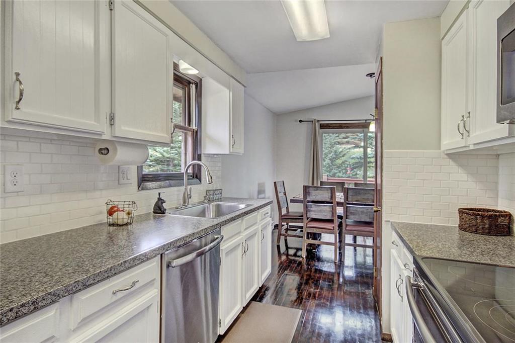 627 Deer Path Road Dillon, CO 80435 - Photo 14 of 25 a kitchen with sink cabinets and wooden floor