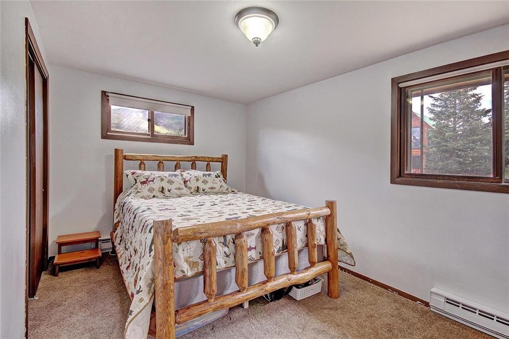 627 Deer Path Road Dillon, CO 80435 - Photo 15 of 25 a bedroom with a bed and a window