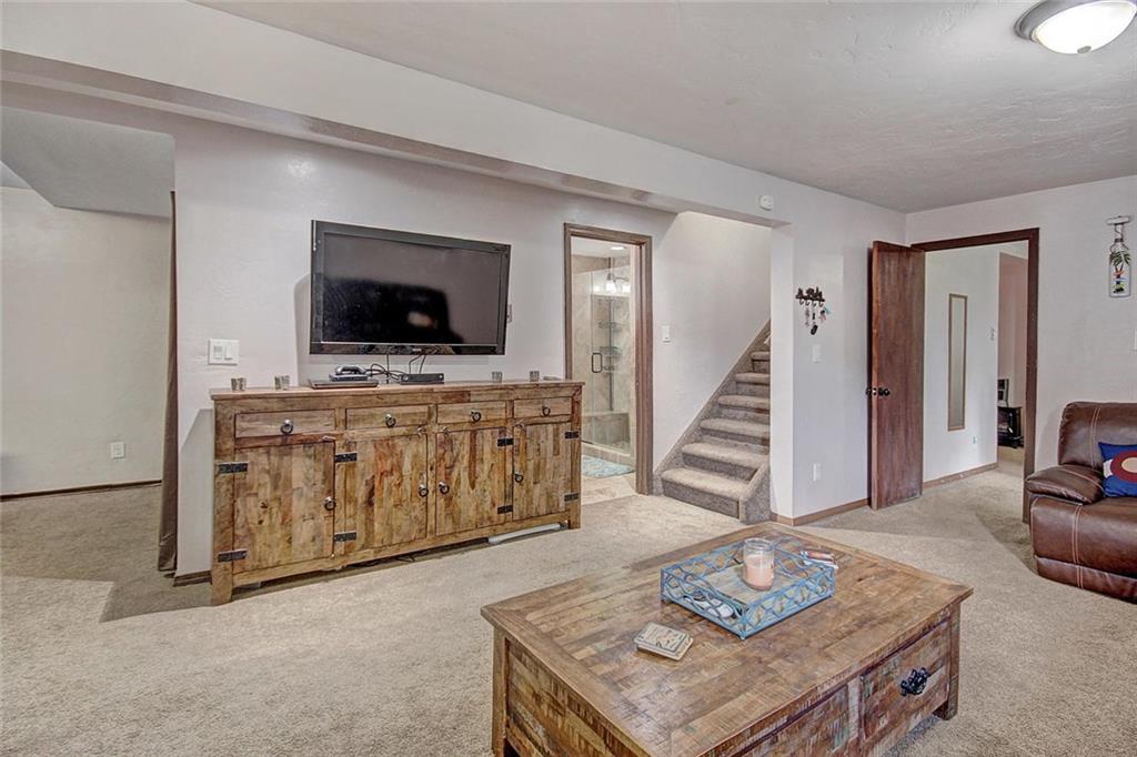 627 Deer Path Road Dillon, CO 80435 - Photo 18 of 25 a living room with furniture and a flat screen tv