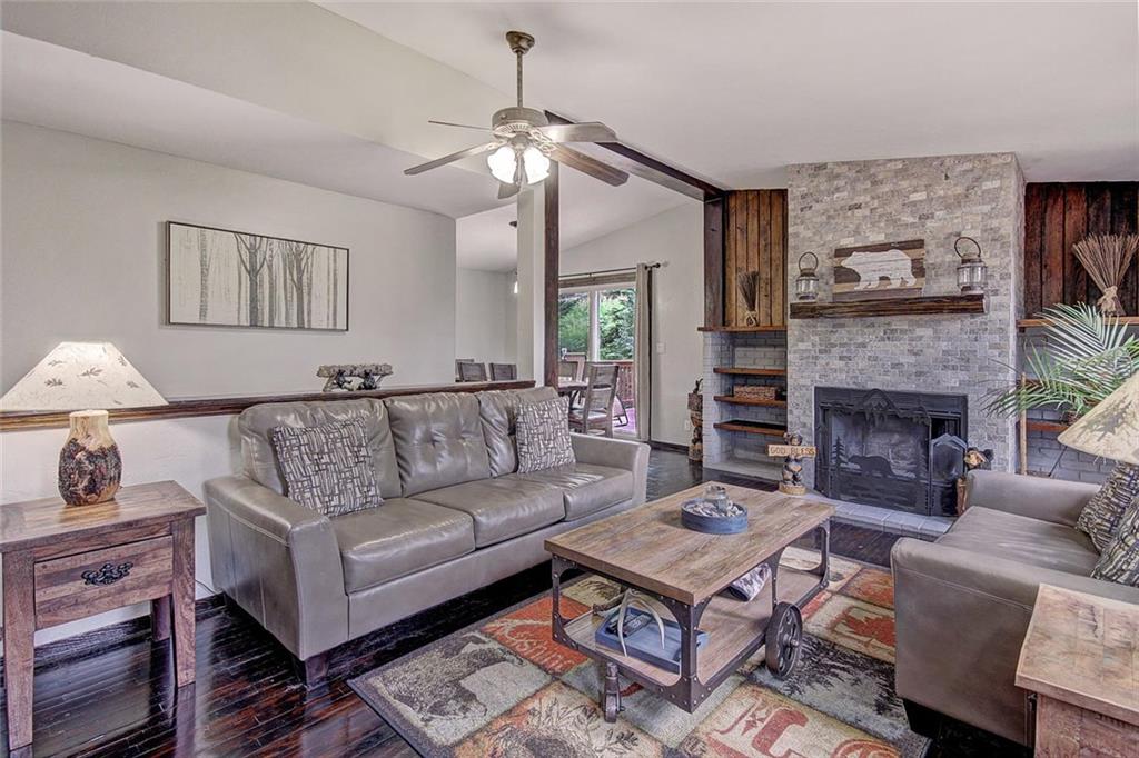 627 Deer Path Road Dillon, CO 80435 - Photo 3 of 25 a living room with furniture and a fireplace