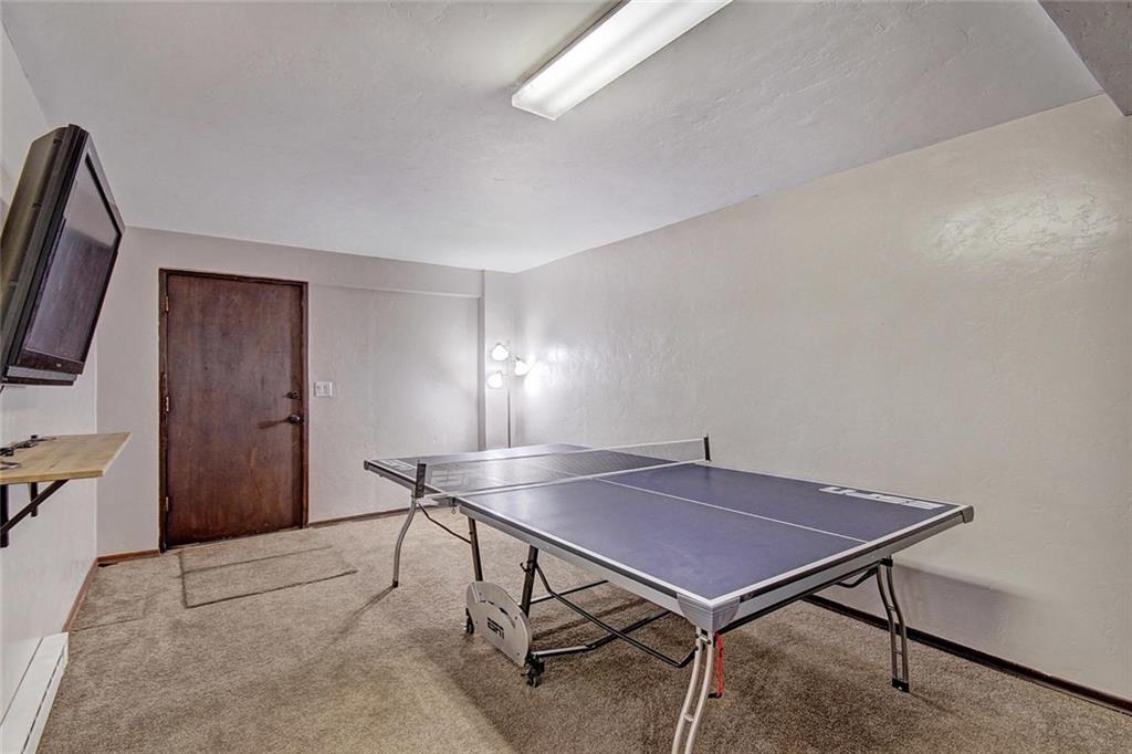 627 Deer Path Road Dillon, CO 80435 - Photo 21 of 25 a room with table chairs and wooden floor