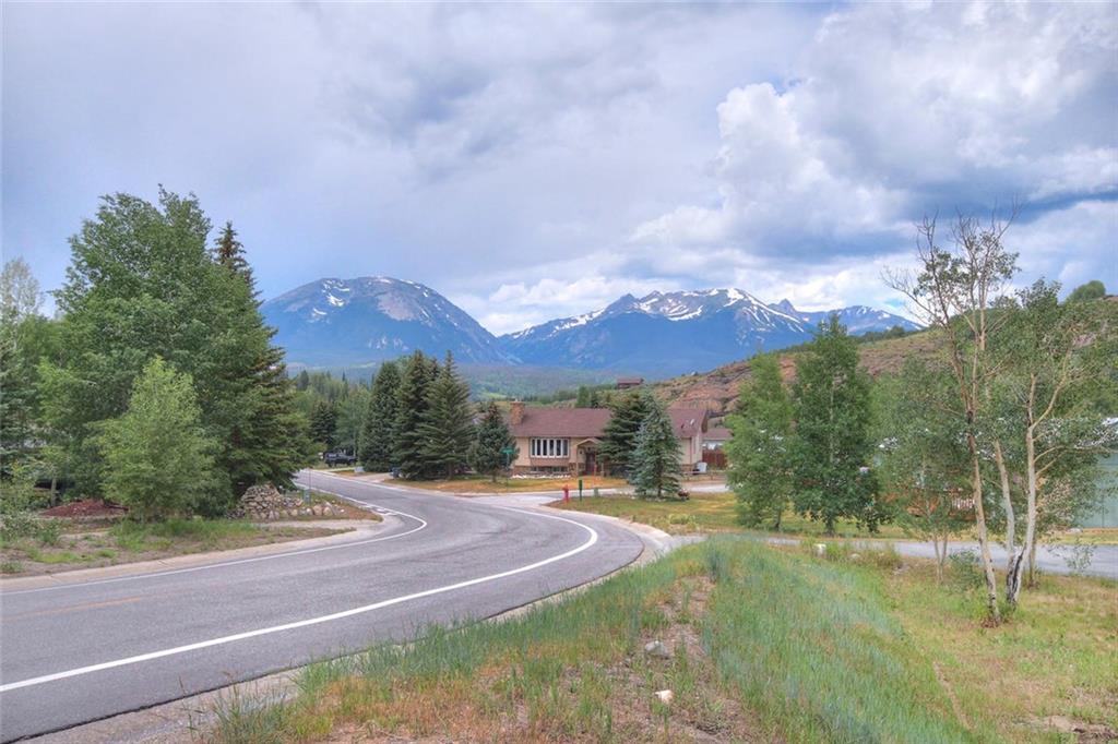 627 Deer Path Road Dillon, CO 80435 - Photo 25 of 25 a view of a houses with yard and mountain view in back
