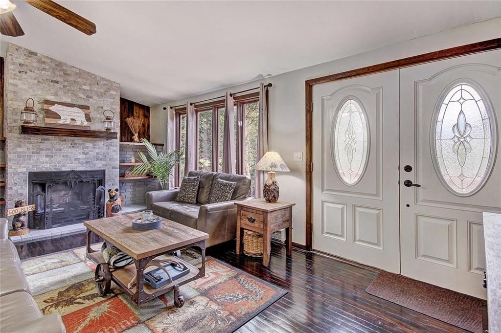 627 Deer Path Road Dillon, CO 80435 - Photo 4 of 25 a living room with furniture a window and a fireplace