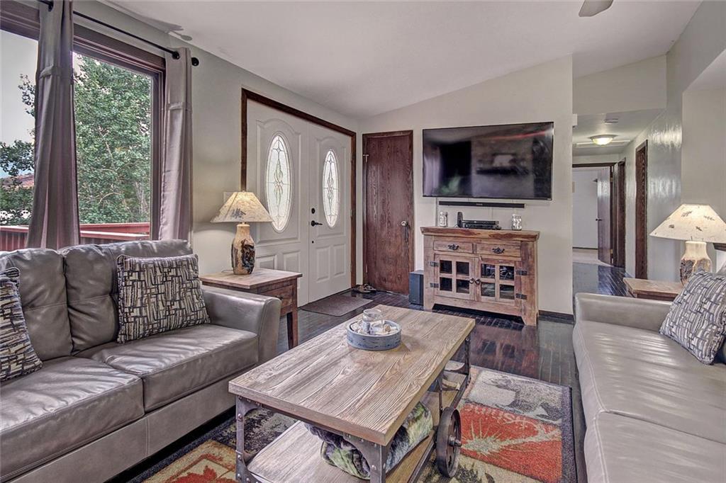 627 Deer Path Road Dillon, CO 80435 - Photo 6 of 25 a living room with furniture and a flat screen tv