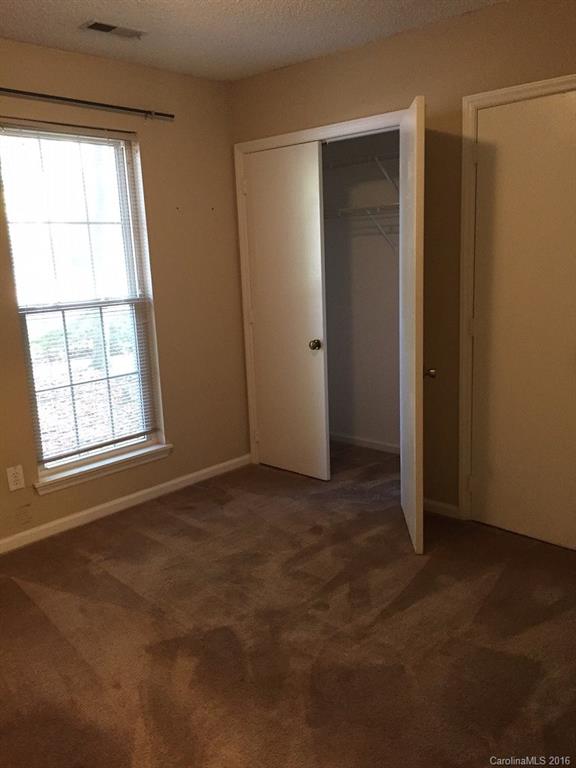 700 Southland Road Huntersville, NC 28078 - Photo 8 of 16 an empty room with windows and closet