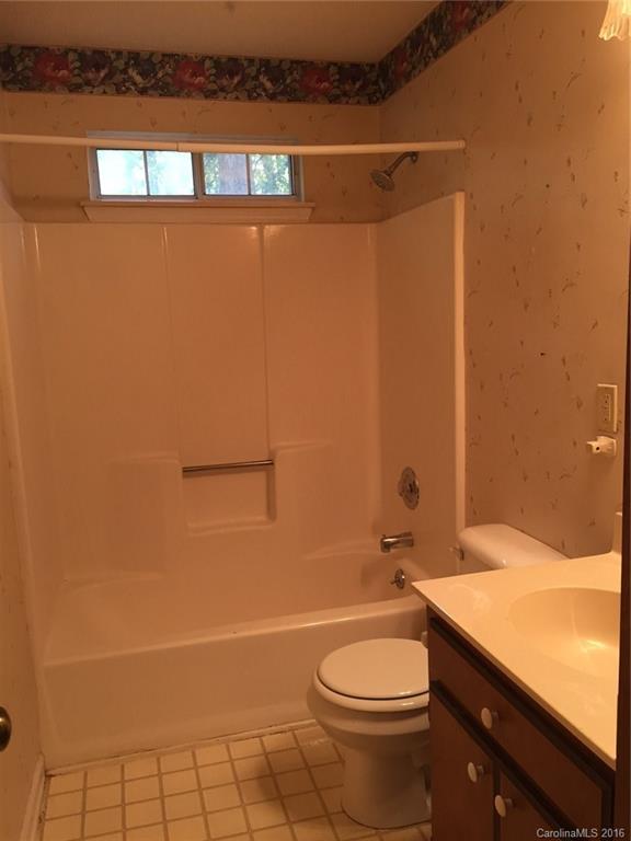 700 Southland Road Huntersville, NC 28078 - Photo 9 of 16 a bathroom with a sink a toilet and shower