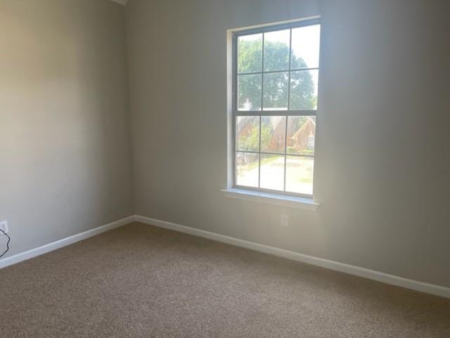 5843 Ridgehill Drive Memphis, TN 38141 - Photo 5 of 6 Carpeted spare room featuring baseboards