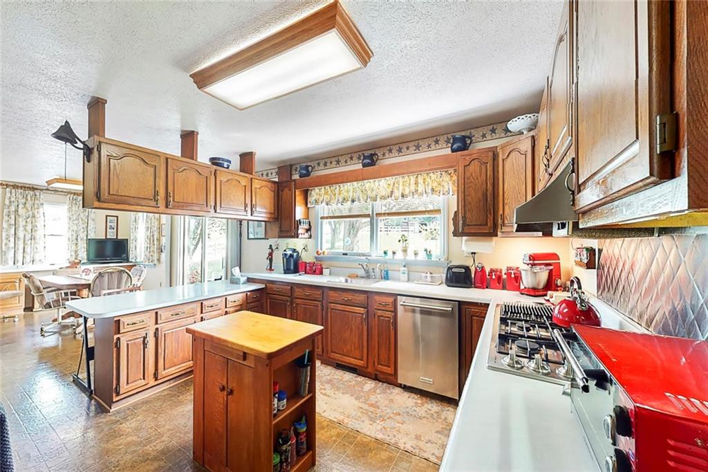 504 North Eighty Eight Road Carmichaels, PA 15320 - Photo 11 of 25 a kitchen with stainless steel appliances granite countertop a sink stove and refrigerator
