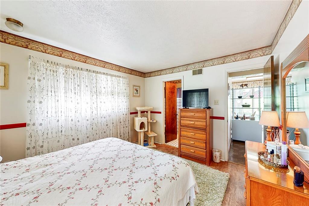 504 North Eighty Eight Road Carmichaels, PA 15320 - Photo 14 of 25 a bedroom with a bed and a dresser in it