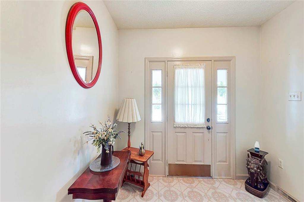 504 North Eighty Eight Road Carmichaels, PA 15320 - Photo 15 of 25 a view of a room with entryway wooden floor and a chandelier