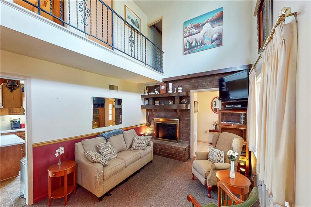 504 North Eighty Eight Road Carmichaels, PA 15320 - Photo 17 of 25 a living room with furniture and a fireplace