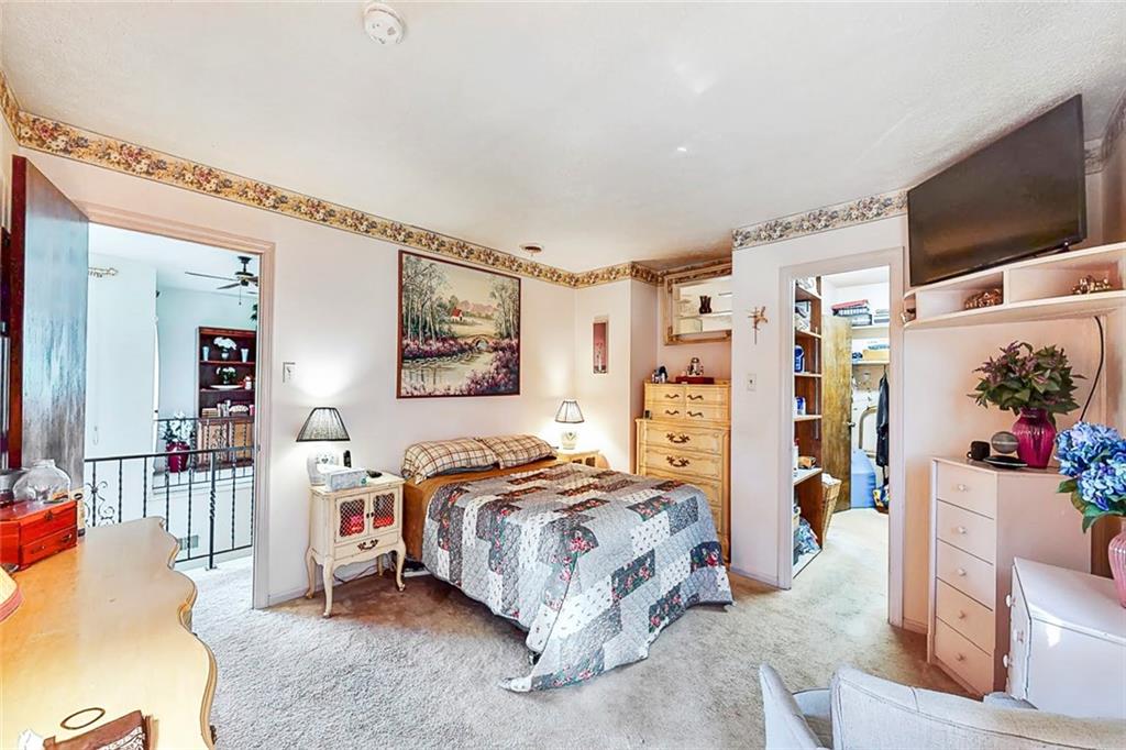 504 North Eighty Eight Road Carmichaels, PA 15320 - Photo 22 of 25 a bedroom with a bed couch and a flat screen tv